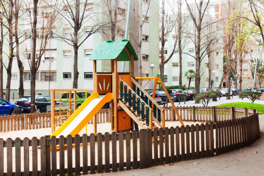 playarea in city with wooden fence