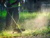Man strimming the lawn